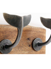Four Whale Hooks on Wooden Plinth
