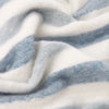 Beechwood Throw Sky Blue Close-up of blue and white striped fabric texture