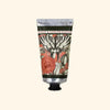 Hand cream tube with decorative label on a white background