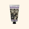 Hand cream tube with botanical design and text on a white background