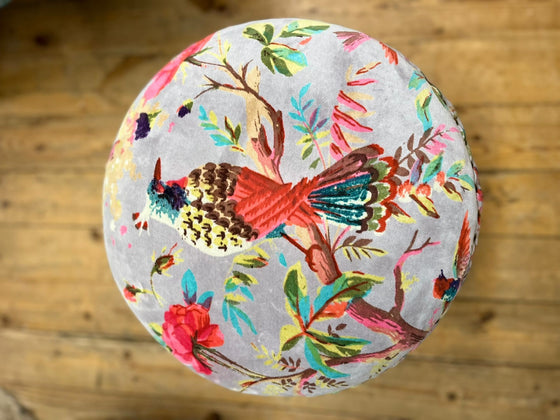 top of footstool with birds of paradise