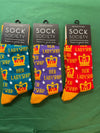 Three pairs of socks with 'Her Ladyship' design in blue, purple, and red packaging on a green background.