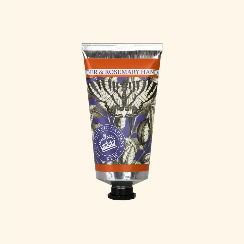 Hand cream tube with decorative label on a beige background