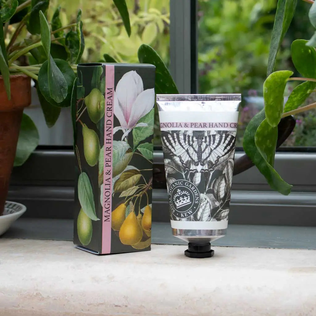 Hand cream with packaging on a surface with plants in the background