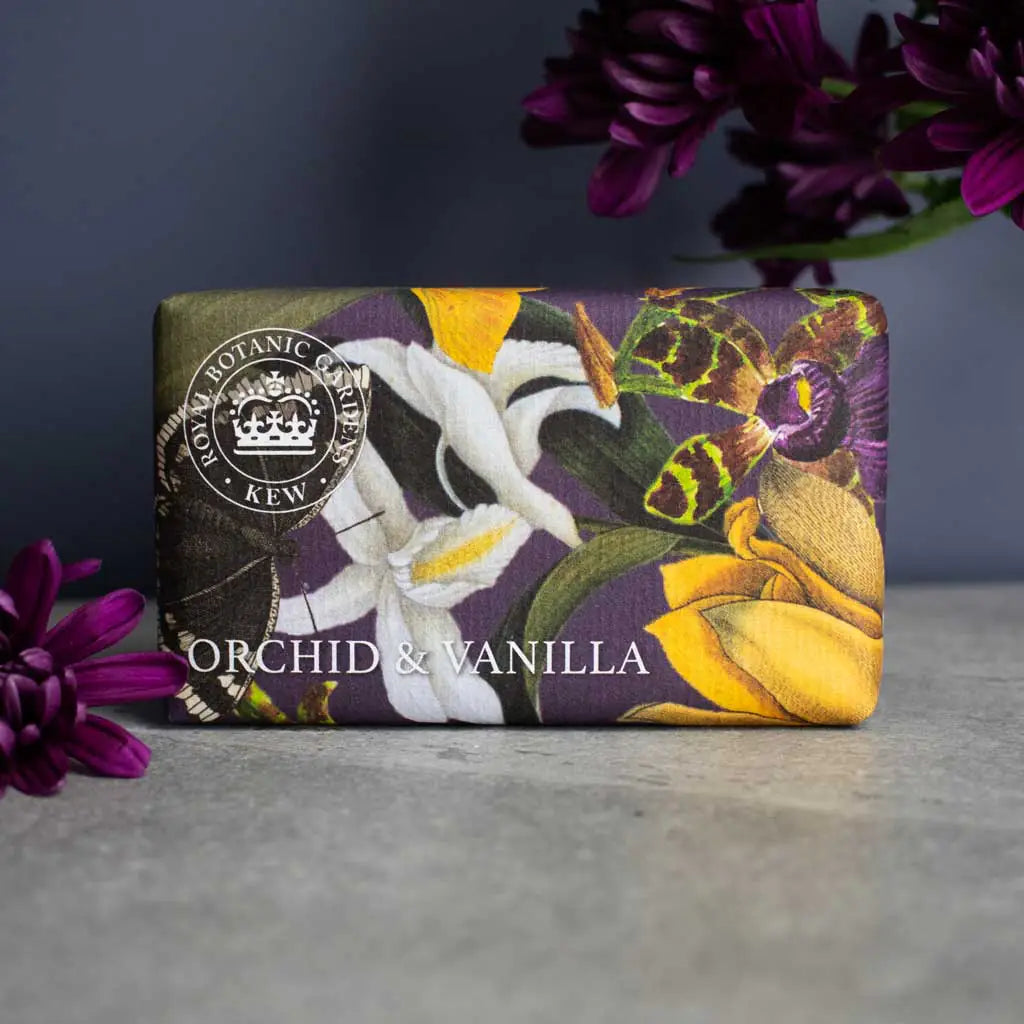 Soap bar with floral design and 'Kew' branding on a dark background