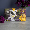 Soap bar with floral design and 'Kew' branding on a dark background