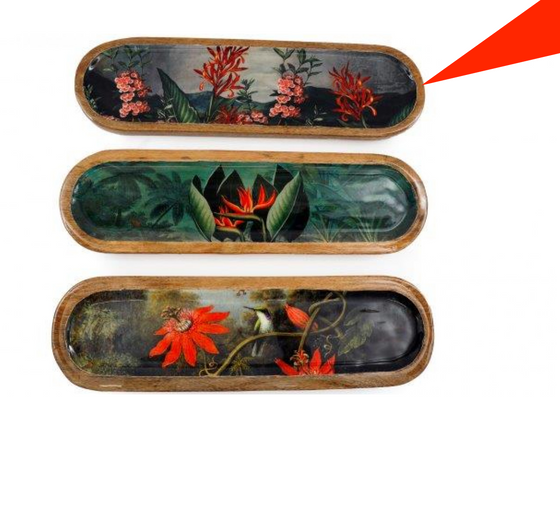 Three decorative trays with floral designs on a white background