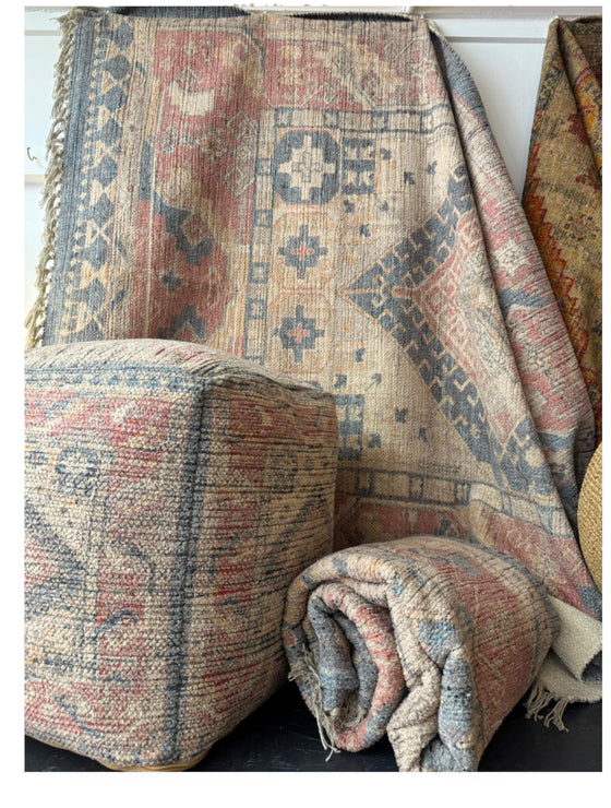 imported rugs and pouffe