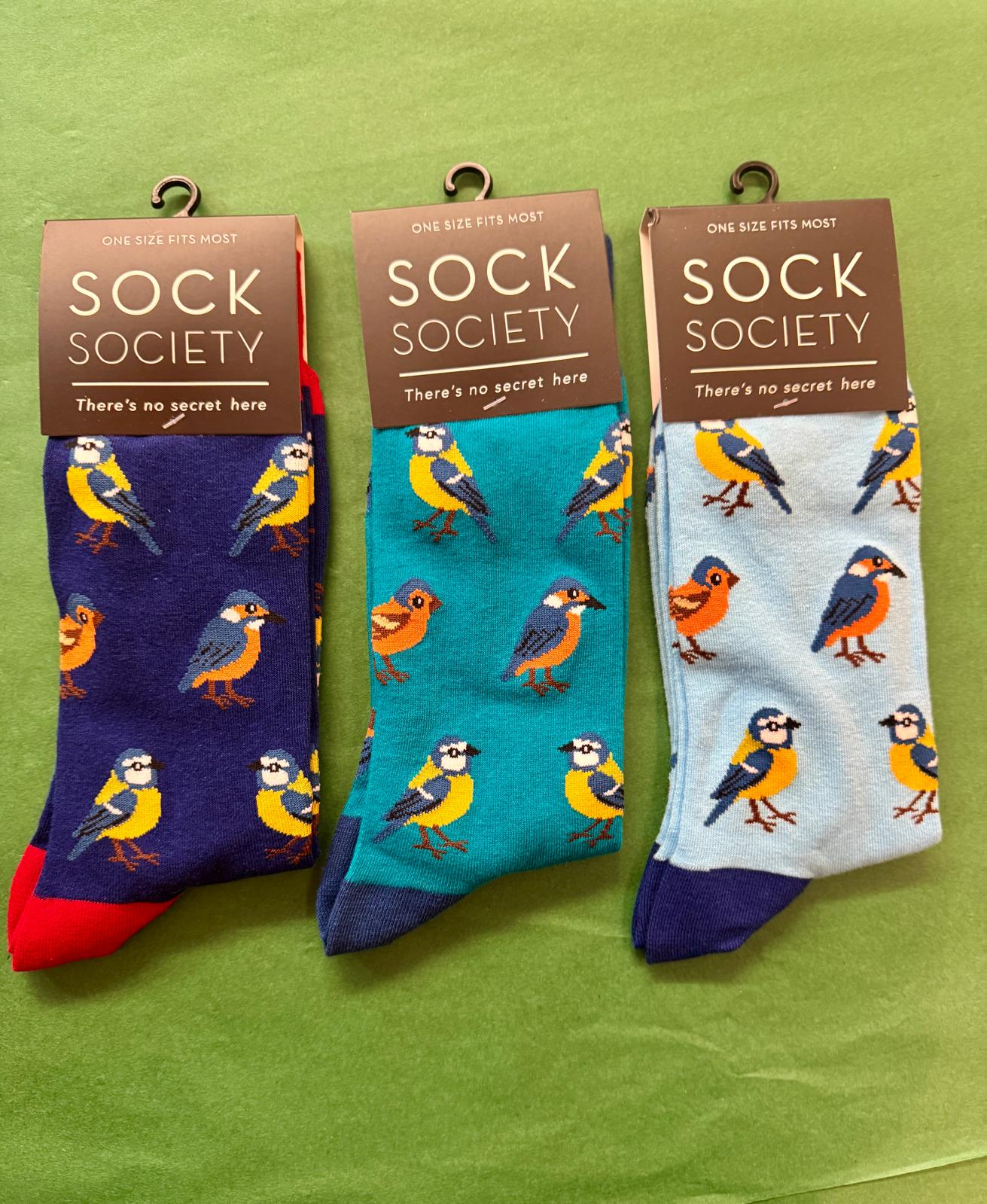 Three pairs of socks with bird patterns 