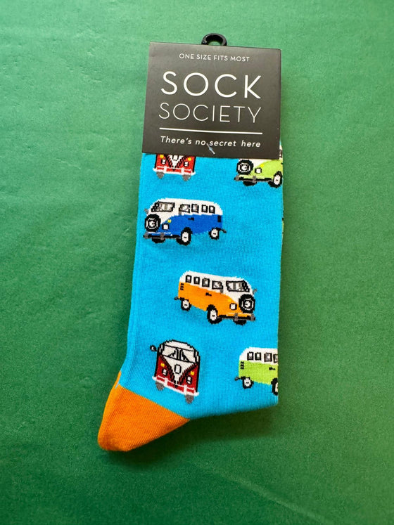 Sock Society sock with camper van design on a green background