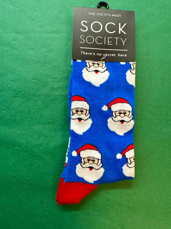 Blue sock with Santa Claus pattern on a green background, featuring 'Sock Society' branding.