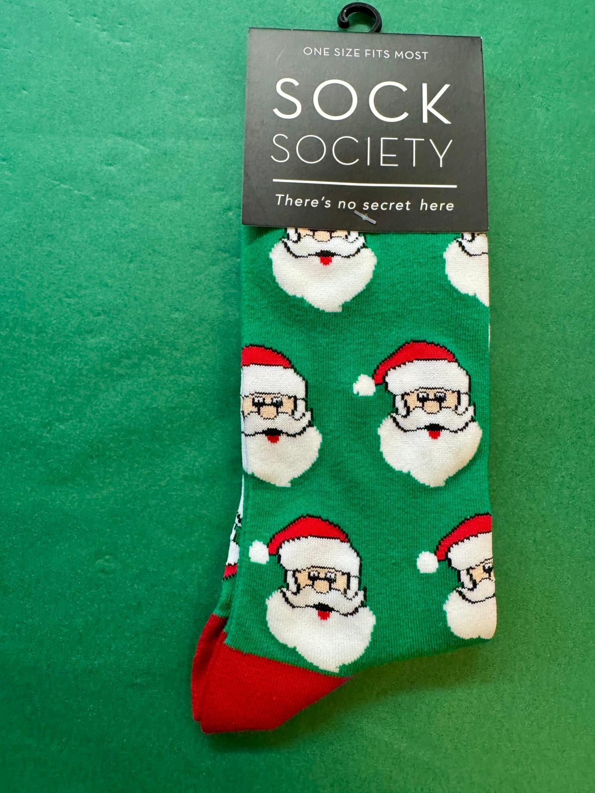 Green sock with Santa Claus pattern on a green background, featuring 'Sock Society' branding.