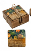 Set of wooden coasters with colorful designs in a wooden box tied with twine.