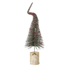  red and green tree decorative Christmas tree with a birch bark base on a white background